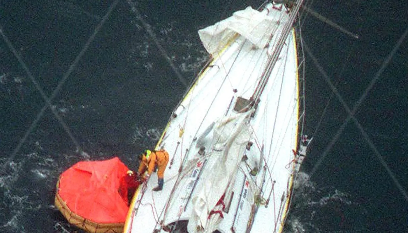 Raphael Dinelli, 28-year-old French lone sailor, is rescued from a life raft by Englishman Pete Goss on his 15-metre yacht