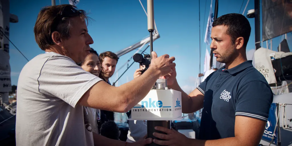 LES SABLES D'OLONNE, FRANCE - OCTOBER 22, 2024: Noé Poffa, Ifremer, and CNES representatives are pictured with Freelance.com skipper Guirec Soudée (FRA) while distributing scientific tools in coordination with UNESCO, to skippers  before start of the Vendee Globe, on October 22, 2024 in Les Sables d'Olonne, France - (Photo by Anne Beauge / Alea)