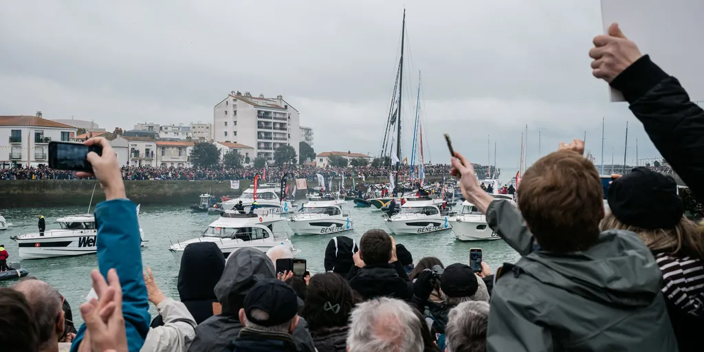 LES SABLES D’OLONNE, FRANCE - FEBRUARY 09, 2025 : Fans are cheering for DMG MORI Global One skipper Kojiro Shiraishi (JAP) and DeVenir skipper Violette Dorange (FRA) taking 24th and 25th place in the Vendee Globe, on February 09, 2025 in Les Sables d'Olonne, France - (Photo by Jean-Louis Carli / Alea)