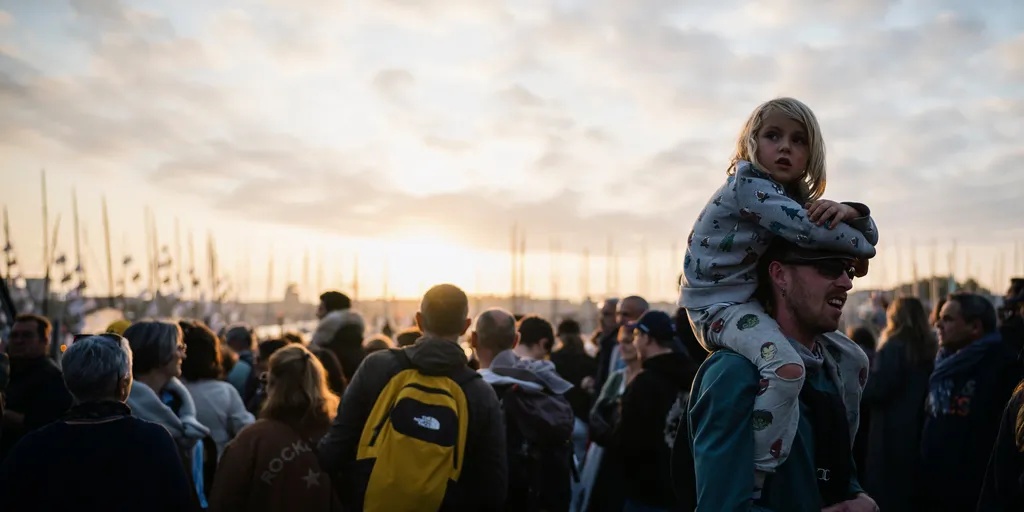LES SABLES D'OLONNE, FRANCE - NOVEMBER 9, 2024: Public is photographed at sunset during prestart of the Vendee Globe, on November 9, 2024 in Les Sables d'Olonne, France - (Photo by Jean-Louis Carli / Alea)