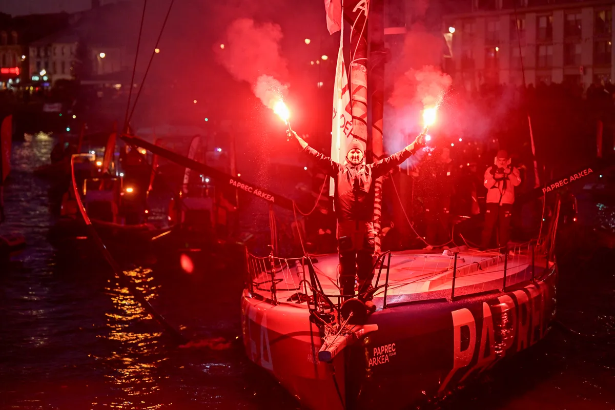 LES SABLES D'OLONNE, FRANCE - JANUARY 15, 2025 : PAPREC ARKÉA skipper Yoann Richomme (FRA) is photographed celebrating with flares in the channel after taking 2nd place in the Vendee Globe, on January 15, 2025 in Les Sables d'Olonne, France - (Photo by Jean-Louis Carli / Alea)