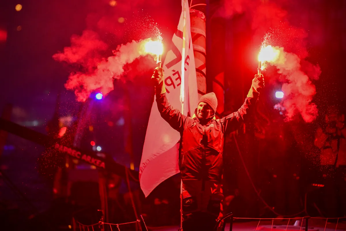 LES SABLES D'OLONNE, FRANCE - JANUARY 15, 2025 : PAPREC ARKÉA skipper Yoann Richomme (FRA) is photographed celebrating with flares in the channel after taking 2nd place in the Vendee Globe, on January 15, 2025 in Les Sables d'Olonne, France - (Photo by Jean-Louis Carli / Alea)
