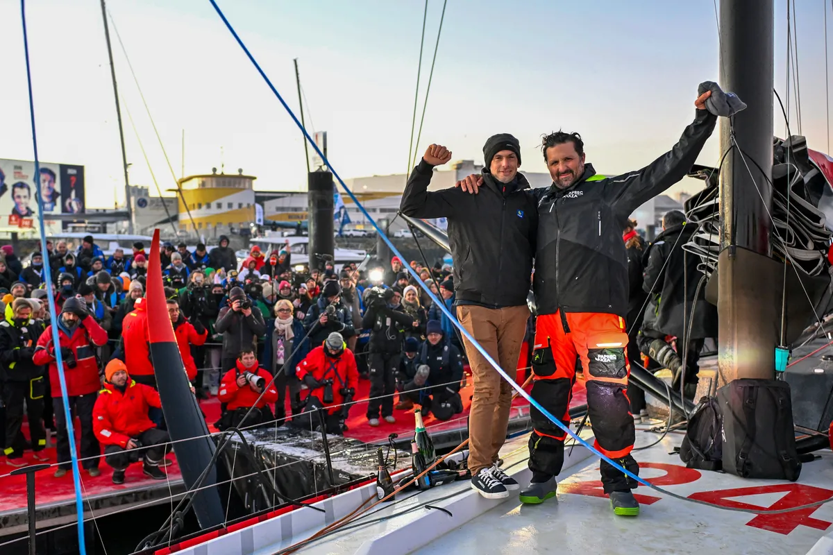 LES SABLES D'OLONNE, FRANCE - JANUARY 15, 2025 : PAPREC ARKÉA skipper Yoann Richomme (FRA) is photographed with winner Charlie Dalin after taking 2nd place in the Vendee Globe, on January 15, 2025 in Les Sables d'Olonne, France - (Photo by Jean-Louis Carli / Alea)