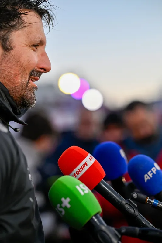 LES SABLES D'OLONNE, FRANCE - JANUARY 15, 2025 : PAPREC ARKÉA skipper Yoann Richomme (FRA) is photographed being interviewed by media after taking 2nd place in the Vendee Globe, on January 15, 2025 in Les Sables d'Olonne, France - (Photo by Jean-Louis Carli / Alea)
