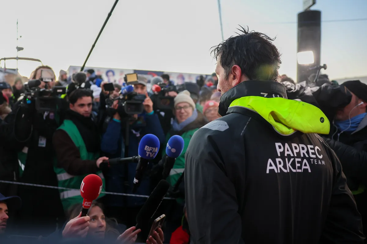 LES SABLES D'OLONNE, FRANCE - JANUARY 15, 2025 : PAPREC ARKÉA skipper Yoann Richomme (FRA) is photographed being interviewed by media after taking 2nd place in the Vendee Globe, on January 15, 2025 in Les Sables d'Olonne, France - (Photo by Jean-Marie Liot / Alea)
