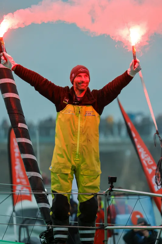 LES SABLES D'OLONNE, FRANCE - JANUARY 25, 2025 : HOLCIM - PRB skipper Nicolas Lunven (FRA) is celebrating with flares in the channel after taking 6th place in the Vendee Globe, on January 25, 2025 in Les Sables d'Olonne, France - (Photo by Anne Beauge / Alea)