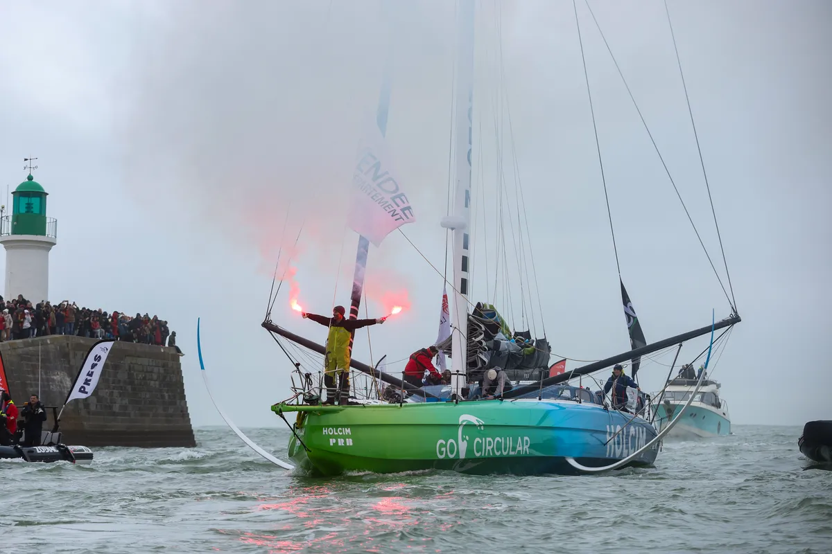 LES SABLES D'OLONNE, FRANCE - JANUARY 25, 2025 : HOLCIM - PRB skipper Nicolas Lunven (FRA) is celebrating with flares in the channel after taking 6th place in the Vendee Globe, on January 25, 2025 in Les Sables d'Olonne, France - (Photo by LloydImages / Alea)
