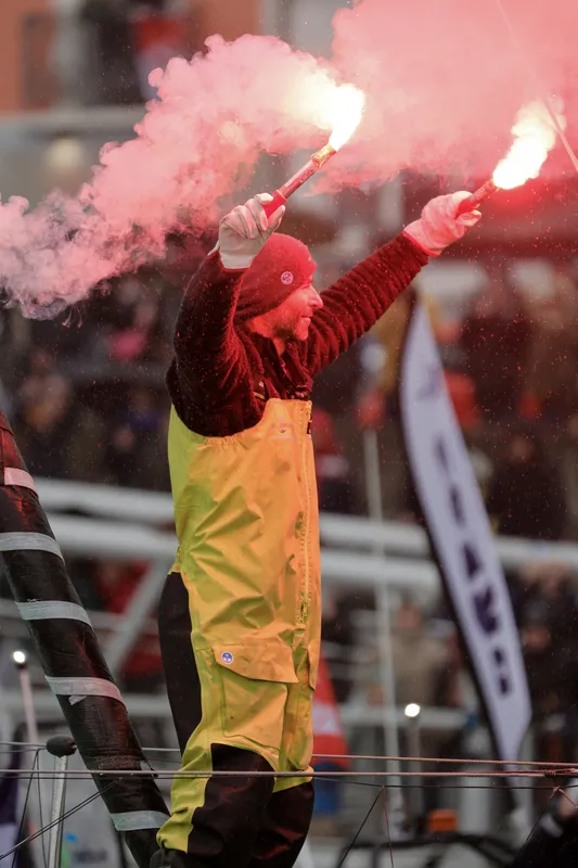 LES SABLES D'OLONNE, FRANCE - JANUARY 25, 2025 : HOLCIM - PRB skipper Nicolas Lunven (FRA) is celebrating with flares in the channel after taking 6th place in the Vendee Globe, on January 25, 2025 in Les Sables d'Olonne, France - (Photo by Anne Beauge / Alea)