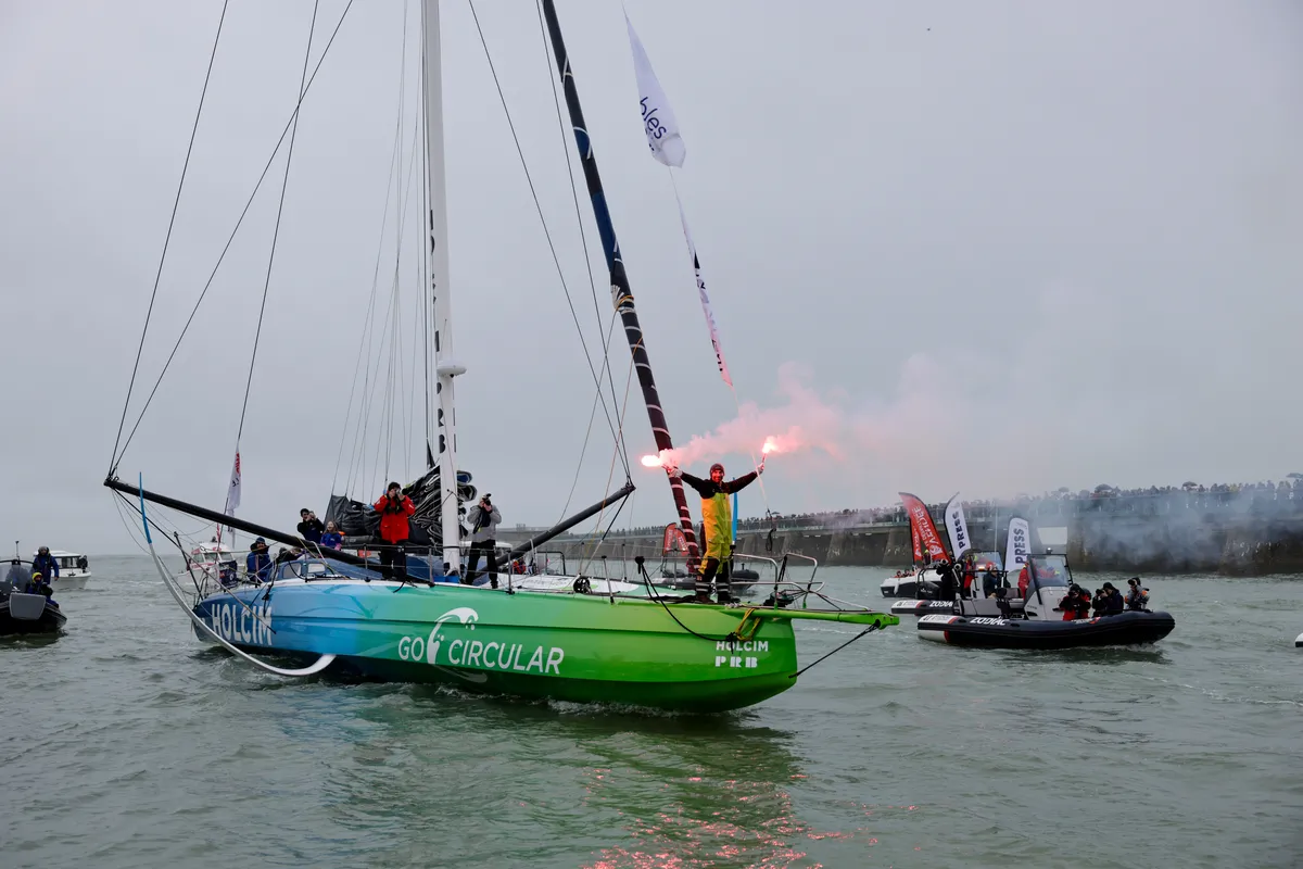 LES SABLES D'OLONNE, FRANCE - JANUARY 25, 2025 : HOLCIM - PRB skipper Nicolas Lunven (FRA) is celebrating with flares in the channel after taking 6th place in the Vendee Globe, on January 25, 2025 in Les Sables d'Olonne, France - (Photo by Anne Beauge / Alea)