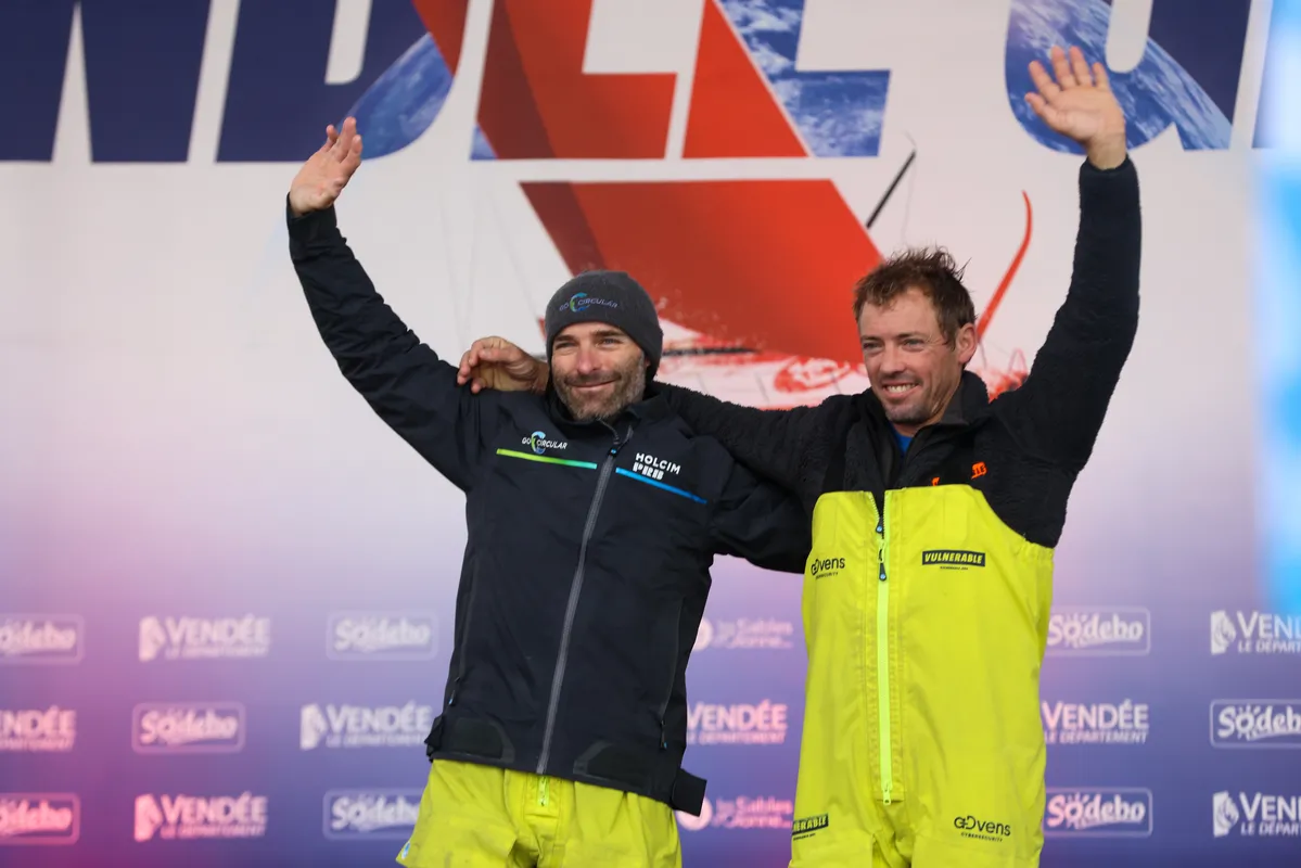 LES SABLES D'OLONNE, FRANCE - JANUARY 25, 2025 : HOLCIM - PRB skipper Nicolas Lunven (FRA) and VULNERABLE skipper Thomas Ruyant (FRA) are photographed on the stage of the Vendee Globe, on January 25, 2025 in Les Sables d'Olonne, France - (Photo by LloydImages / Alea)