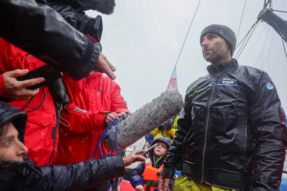 LES SABLES D'OLONNE, FRANCE - JANUARY 25, 2025 : HOLCIM - PRB skipper Nicolas Lunven (FRA) is being interviewed by media after taking 6th place in the Vendee Globe, on January 25, 2025 in Les Sables d'Olonne, France - (Photo by Jean-Marie Liot / Alea)