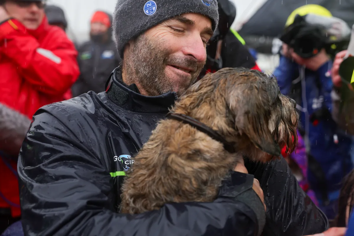 LES SABLES D'OLONNE, FRANCE - JANUARY 25, 2025 : HOLCIM - PRB skipper Nicolas Lunven (FRA) is photographed with his dog after taking 6th place in the Vendee Globe, on January 25, 2025 in Les Sables d'Olonne, France - (Photo by Jean-Marie Liot / Alea)