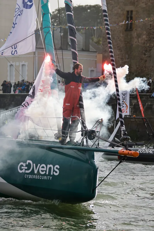 LES SABLES D'OLONNE, FRANCE - JANUARY 25, 2025 : VULNERABLE skipper Sam Goodchild (GBR) is celebrating with flares after taking 9th place in the Vendee Globe, on January 25, 2025 in Les Sables d'Olonne, France - (Photo by Anne Beauge / Alea)