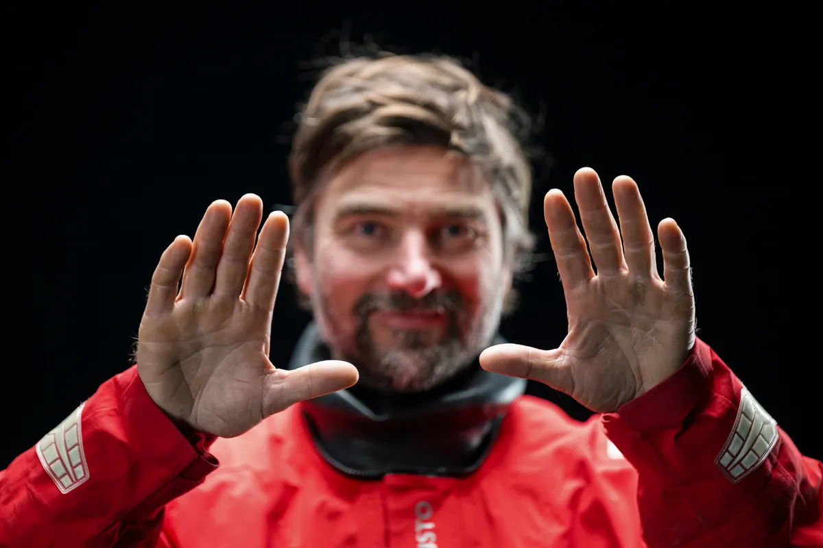 LES SABLES D'OLONNE, FRANCE - JANUARY 30, 2025 : Malizia - Seaexplorer skipper Boris Herrmann (GER) is photographed in studio with a German flag after taking 12th place in the Vendee Globe, on January 30, 2025 in Les Sables d'Olonne, France - (Photo by Olivier Blanchet / Alea)