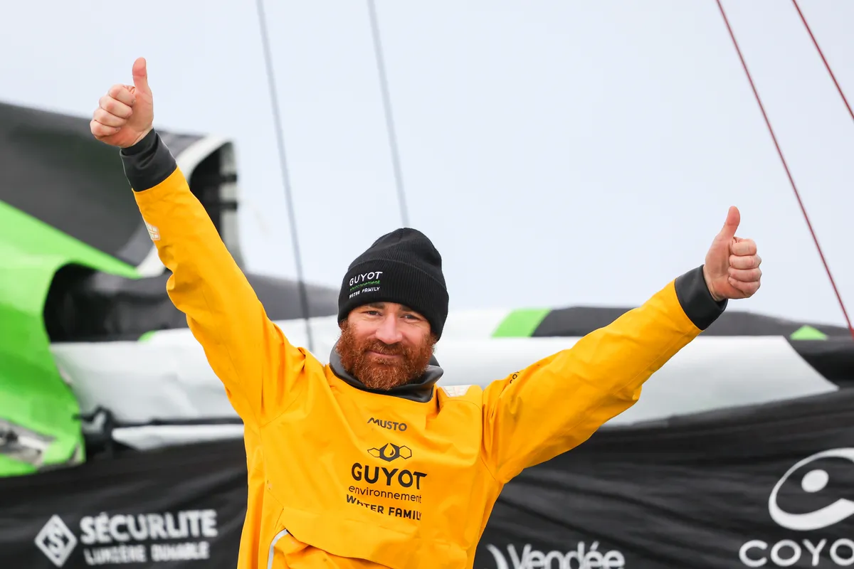 LES SABLES D'OLONNE, FRANCE - JANUARY 31, 2025 : GUYOT Environnement - Water Family skipper Benjamin Dutreux (FRA)) is celebrating in the channel after taking 10th place in the Vendee Globe, on January 31, 2025 in Les Sables d'Olonne, France - (Photo by Lloyd Images / Alea)