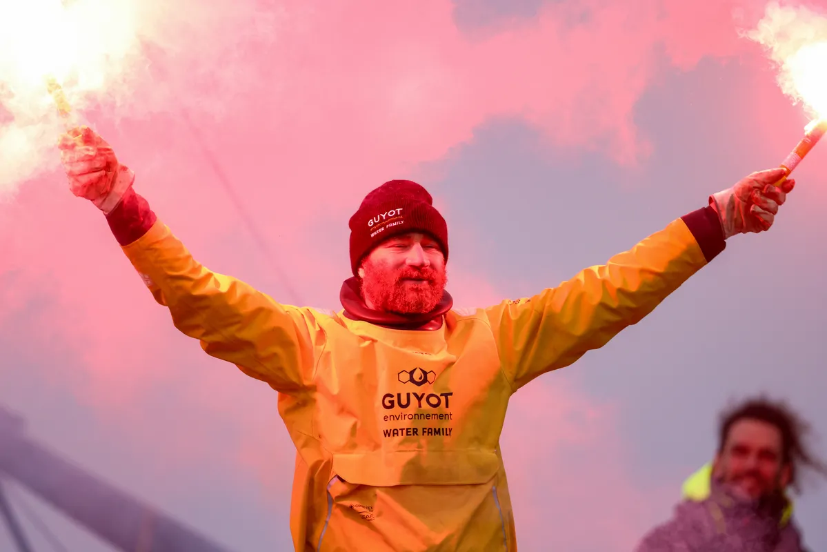 LES SABLES D'OLONNE, FRANCE - JANUARY 31, 2025 : GUYOT Environnement - Water Family skipper Benjamin Dutreux (FRA)) is celebrating in the channel after taking 10th place in the Vendee Globe, on January 31, 2025 in Les Sables d'Olonne, France - (Photo by Lloyd Images / Alea)