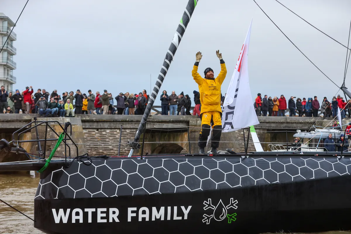 LES SABLES D'OLONNE, FRANCE - JANUARY 31, 2025 : GUYOT Environnement - Water Family skipper Benjamin Dutreux (FRA)) is celebrating in the channel after taking 10th place in the Vendee Globe, on January 31, 2025 in Les Sables d'Olonne, France - (Photo by Lloyd Images / Alea)