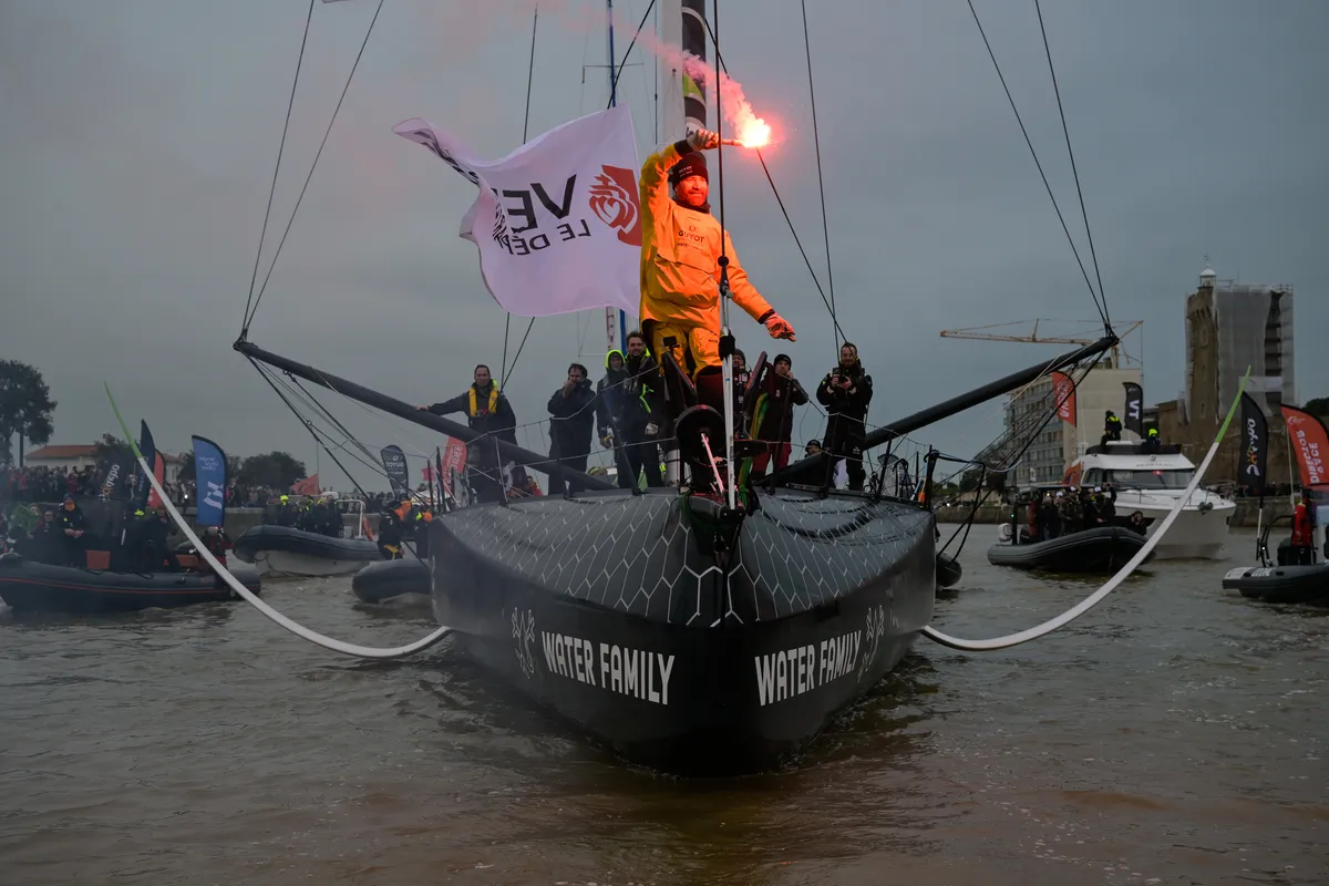 LES SABLES D'OLONNE, FRANCE - JANUARY 31, 2025 : GUYOT Environnement - Water Family skipper Benjamin Dutreux (FRA)) is celebrating in the channel after taking 10th place in the Vendee Globe, on January 31, 2025 in Les Sables d'Olonne, France - (Photo by Olivier Blanchet / Alea)