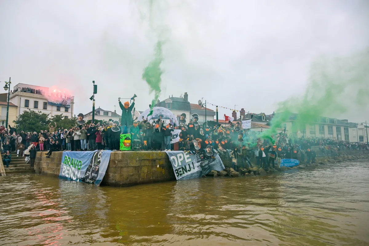 LES SABLES D'OLONNE, FRANCE - JANUARY 31, 2025 : GUYOT Environnement - Water Family skipper Benjamin Dutreux (FRA) fans are celebrating in the channel after he takes 10th place in the Vendee Globe, on January 31, 2025 in Les Sables d'Olonne, France - (Photo by Olivier Blanchet / Alea)