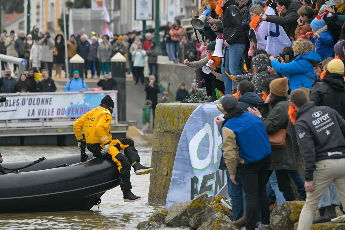 LES SABLES D'OLONNE, FRANCE - JANUARY 31, 2025 : GUYOT Environnement - Water Family skipper Benjamin Dutreux (FRA)) is celebrating in the channel after taking 10th place in the Vendee Globe, on January 31, 2025 in Les Sables d'Olonne, France - (Photo by Olivier Blanchet / Alea)