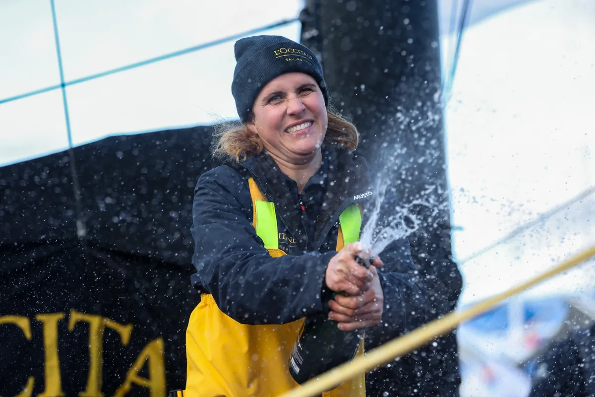 LES SABLES D’OLONNE, FRANCE - FEBRUARY 01, 2025 : L’Occitane en Provence skipper Clarisse Crémer (FRA) is celebrating with champagne after taking 11th place in the Vendee Globe, on February 01, 2025 in Les Sables d'Olonne, France - (Photo by Lloyd Images / Alea)