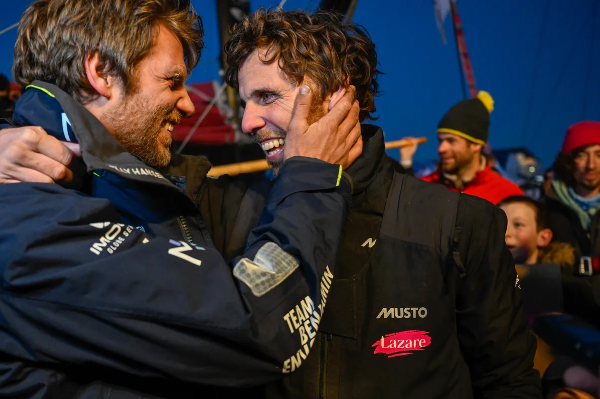 LES SABLES D’OLONNE, FRANCE - FEBRUARY 03, 2025 : Lazare skipper Tanguy Le Turquais (FRA) is celebrating with Monnoyeur - DUO for a JOB skipper Benjamin Ferré (FRA) after taking 17th place in the Vendee Globe, on February 03, 2025 in Les Sables d'Olonne, France - (Photo by Jean-Louis Carli / Alea)