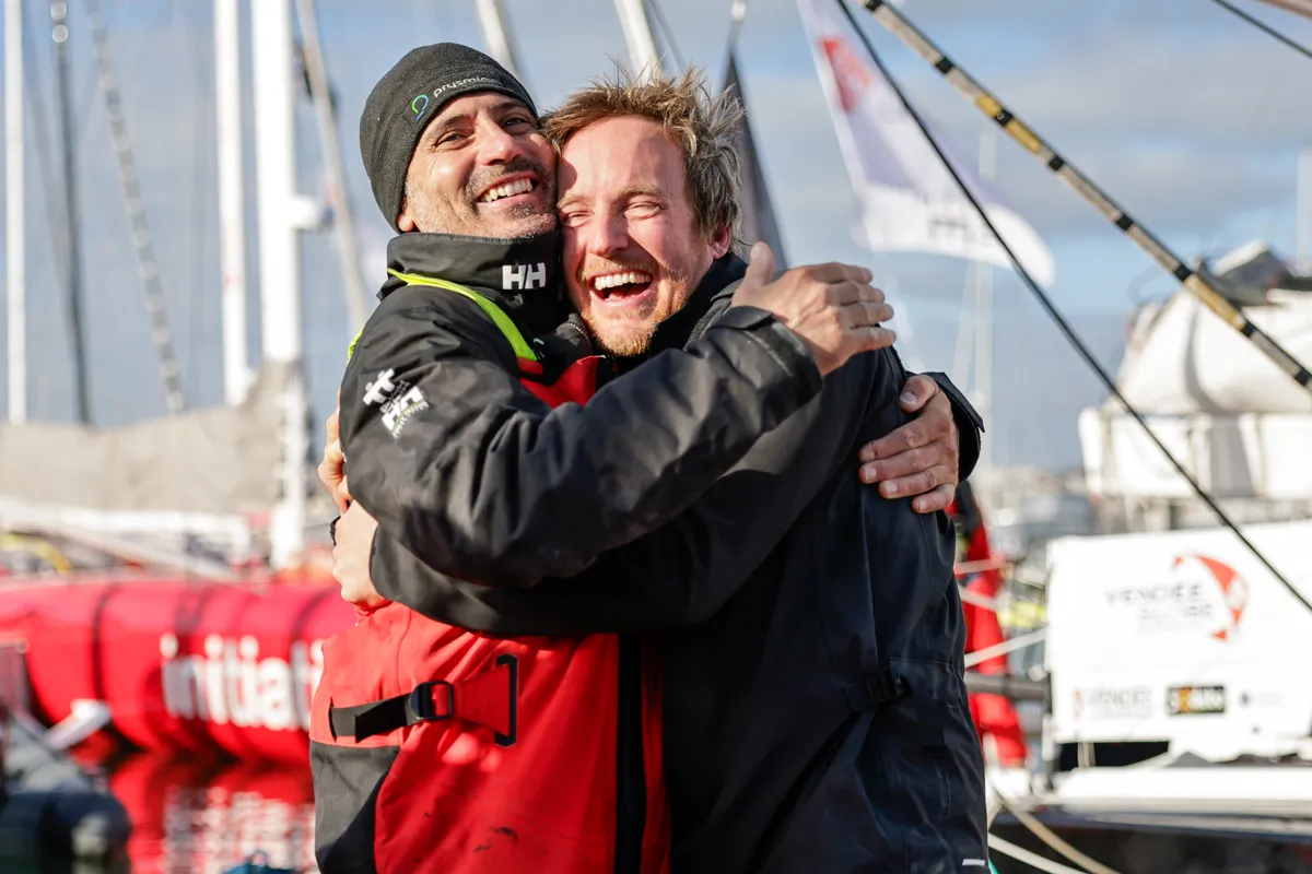 LES SABLES D’OLONNE, FRANCE - FEBRUARY 04, 2025 : MS Amlin skipper Conrad Colman (NZL) and Prysmian skipper Giancarlo Pedote (ITA) are photographed on the pontoon after taking 21st & 22nd place in the Vendee Globe, on February 04, 2025 in Les Sables d'Olonne, France - (Photo by Anne Beauge / Alea)