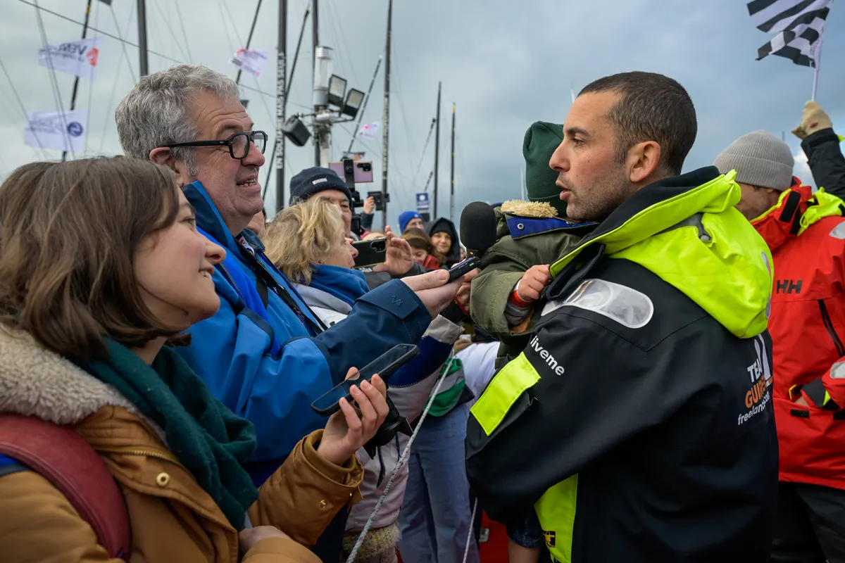 LES SABLES D’OLONNE, FRANCE - FEBRUARY 08, 2025 : Freelance.com skipper Guirec Soudée (FRA) is being interviewed by media after taking 23rd place in the Vendee Globe, on February 08, 2025 in Les Sables d'Olonne, France - (Photo by Olivier Blanchet / Alea)