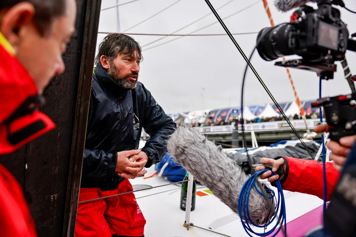 LES SABLES D'OLONNE, FRANCE - 09 FEVRIER 2025 : Le skipper de Fives Group - Lantana Environnement Louis Duc (FRA) est photographié dans le chenal après avoir pris la 26ème place du Vendée Globe, le 09 février 2025 aux Sables d'Olonne, France - (Photo by Anne Beauge / Alea)
