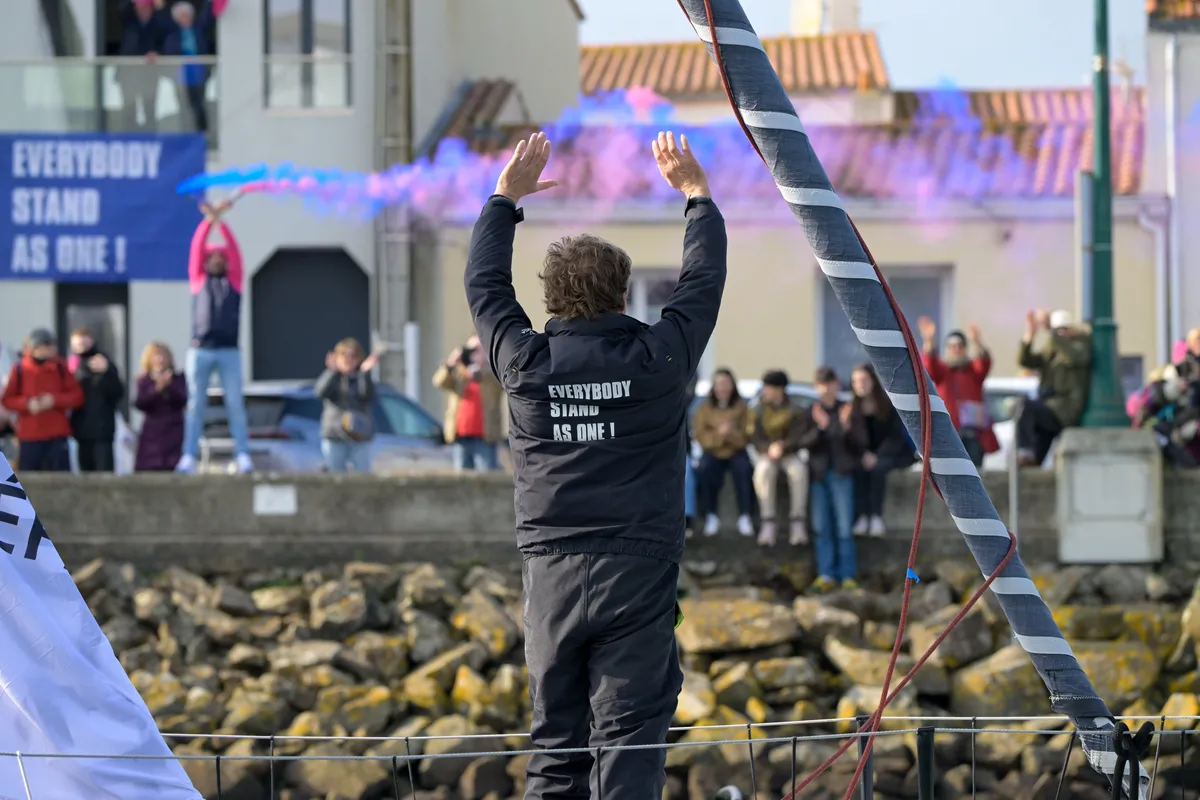 LES SABLES D’OLONNE, FRANCE - FEBRUARY 12, 2025 : STAND AS ONE - Altavia skipper Eric Bellion (FRA) is celebrating after finishing the Vendee Globe off-race, on February 12, 2025 in Les Sables d'Olonne, France - (Photo by Olivier Blanchet / Alea)
