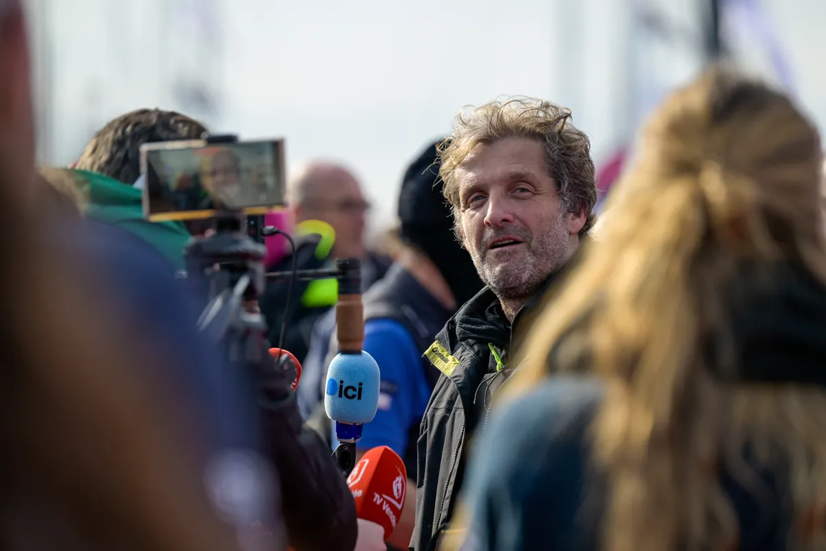 LES SABLES D’OLONNE, FRANCE - FEBRUARY 12, 2025 : STAND AS ONE - Altavia skipper Eric Bellion (FRA) is being interviewed by media after finishing the Vendee Globe off-race, on February 12, 2025 in Les Sables d'Olonne, France - (Photo by Olivier Blanchet / Alea)