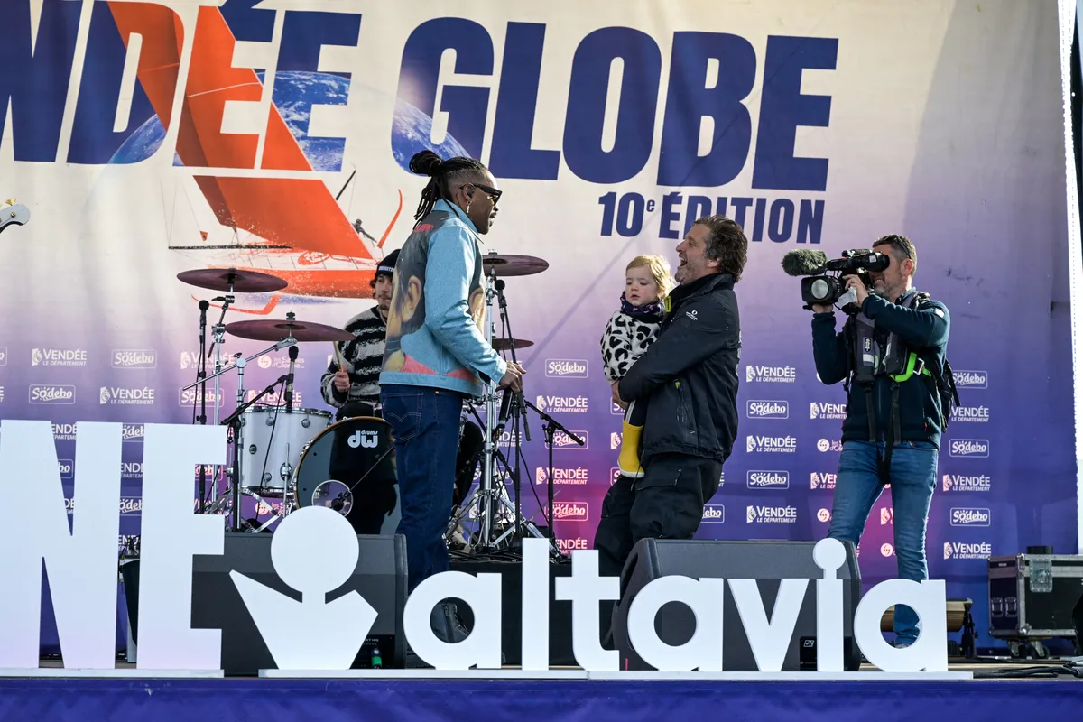 LES SABLES D’OLONNE, FRANCE - FEBRUARY 12, 2025 : STAND AS ONE - Altavia skipper Eric Bellion (FRA) is photographed on stage with the music band "Skip The Use" after finishing the Vendee Globe off-race, on February 12, 2025 in Les Sables d'Olonne, France - (Photo by Olivier Blanchet / Alea)