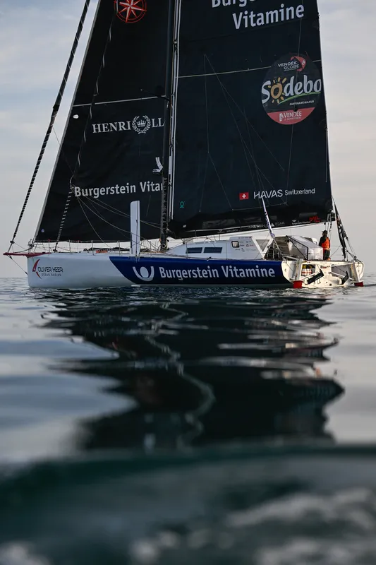 LES SABLES D’OLONNE, FRANCE - FEBRUARY 17, 2025 : Tut Gut. Sailing skipper Oliver Heer (SUI) is photographed taking 29th place in the Vendee Globe under a very calm weather, on February 17, 2025 in Les Sables d'Olonne, France - (Photo by Jean-Louis Carli / Alea)