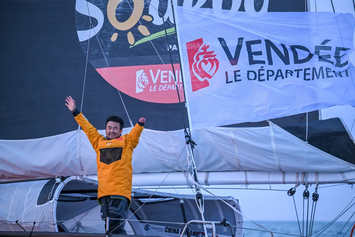 LES SABLES D'OLONNE, FRANCE - 18 FEVRIER 2025 : Le skipper de Singchain Team Haikou, Jingkun Xu (CN), fête sa 30ème place dans le Vendée Globe, le 18 février 2025 aux Sables d'Olonne, France - (Photo by Vincent Curutchet / Alea)