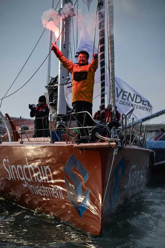 LES SABLES D’OLONNE, FRANCE - FEBRUARY 18, 2025 : Singchain Team Haikou skipper Jingkun Xu (CN) is taking 30th place in the Vendee Globe, on February 18, 2025 in Les Sables d'Olonne, France - (Photo by Jean-Louis Carli / Alea)