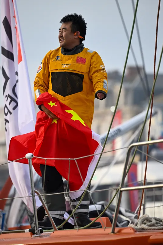 LES SABLES D’OLONNE, FRANCE - FEBRUARY 18, 2025 : Singchain Team Haikou skipper Jingkun Xu (CN) is taking 30th place in the Vendee Globe, on February 18, 2025 in Les Sables d'Olonne, France - (Photo by Jean-Louis Carli / Alea)
