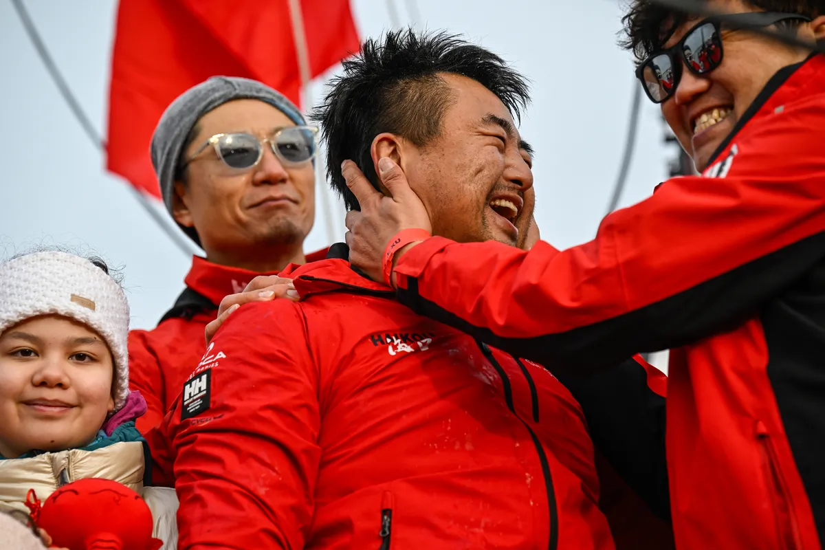 LES SABLES D’OLONNE, FRANCE - FEBRUARY 18, 2025 : Singchain Team Haikou skipper Jingkun Xu (CN) is celebrating with his team after taking 30th place in the Vendee Globe, on February 18, 2025 in Les Sables d'Olonne, France - (Photo by Jean-Louis Carli / Alea)