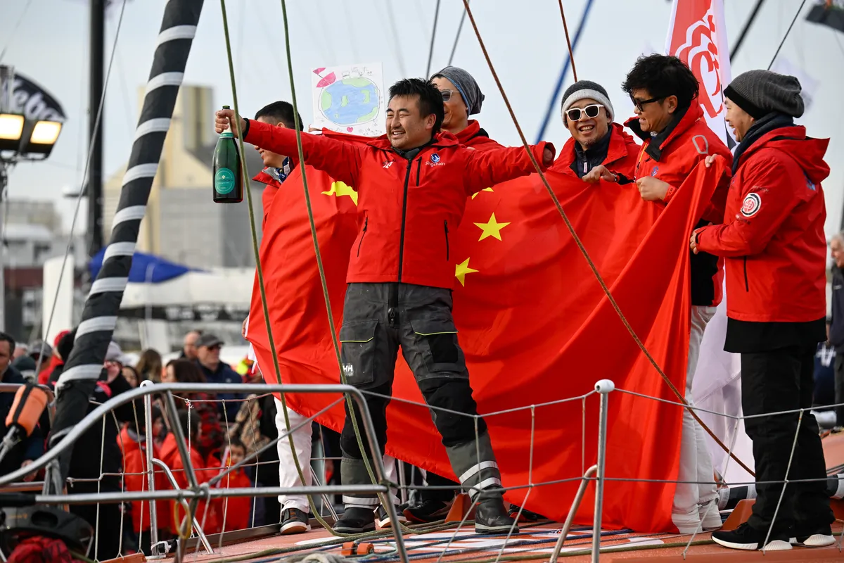LES SABLES D’OLONNE, FRANCE - FEBRUARY 18, 2025 : Singchain Team Haikou skipper Jingkun Xu (CN) is celebrating taking 30th place in the Vendee Globe, on February 18, 2025 in Les Sables d'Olonne, France - (Photo by Jean-Louis Carli / Alea)