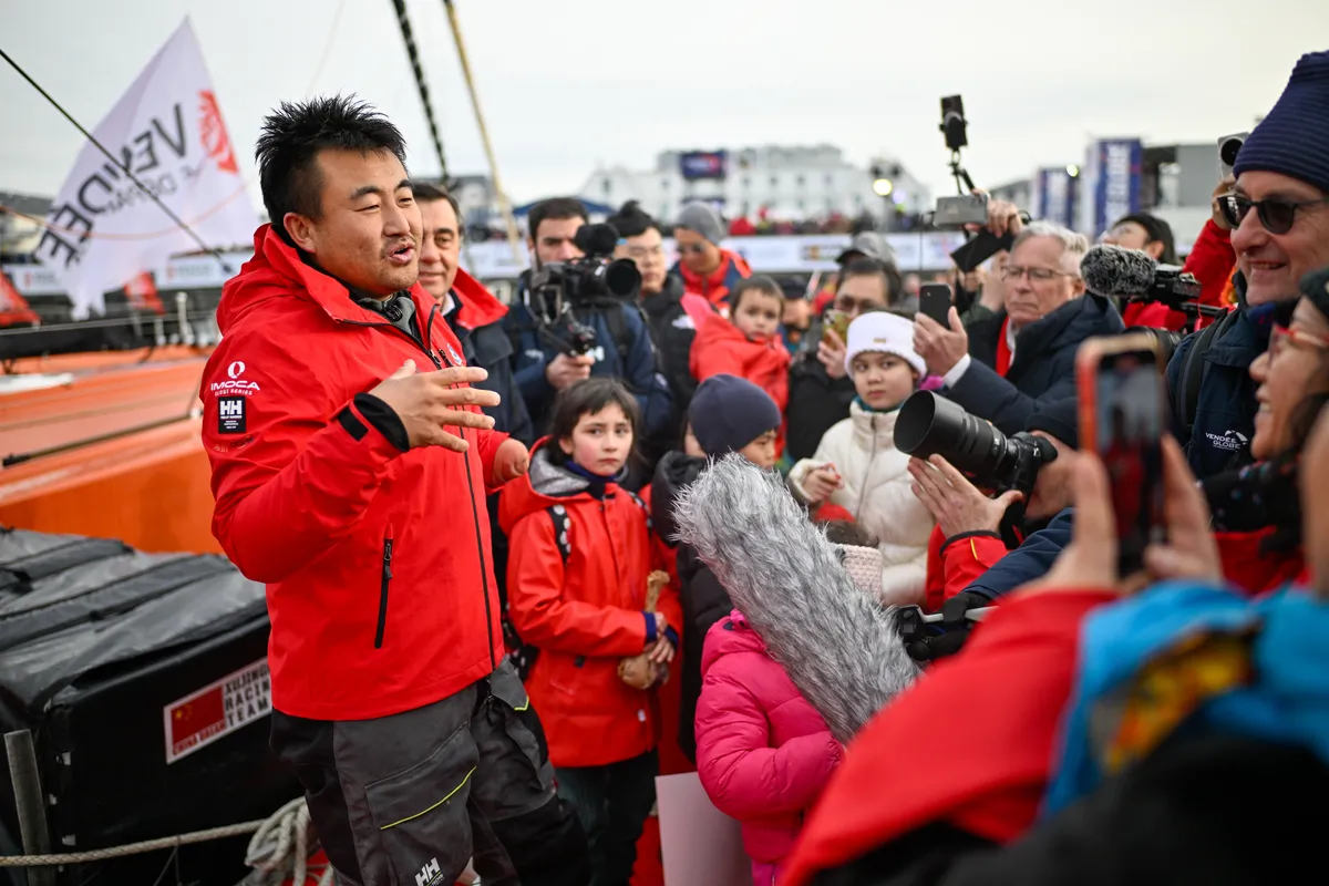 LES SABLES D’OLONNE, FRANCE - FEBRUARY 18, 2025 : Singchain Team Haikou skipper Jingkun Xu (CN) is being interviewed by media after taking 30th place in the Vendee Globe, on February 18, 2025 in Les Sables d'Olonne, France - (Photo by Jean-Louis Carli / Alea)