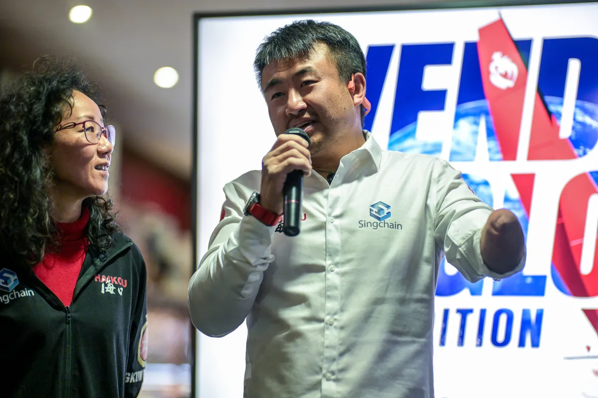 LES SABLES D'OLONNE, FRANCE - FEBRUARY 18, 2025 : Tut Gut. Sailing skipper Oliver Heer (SUI) and Singchain Team Haikou skipper Jingkun Xu (CN) are photographed at the Skippers Finishers Club of the Vendee Globe, on February 18, 2025 in Les Sables d'Olonne, France - (Photo by Vincent Curutchet / Alea)