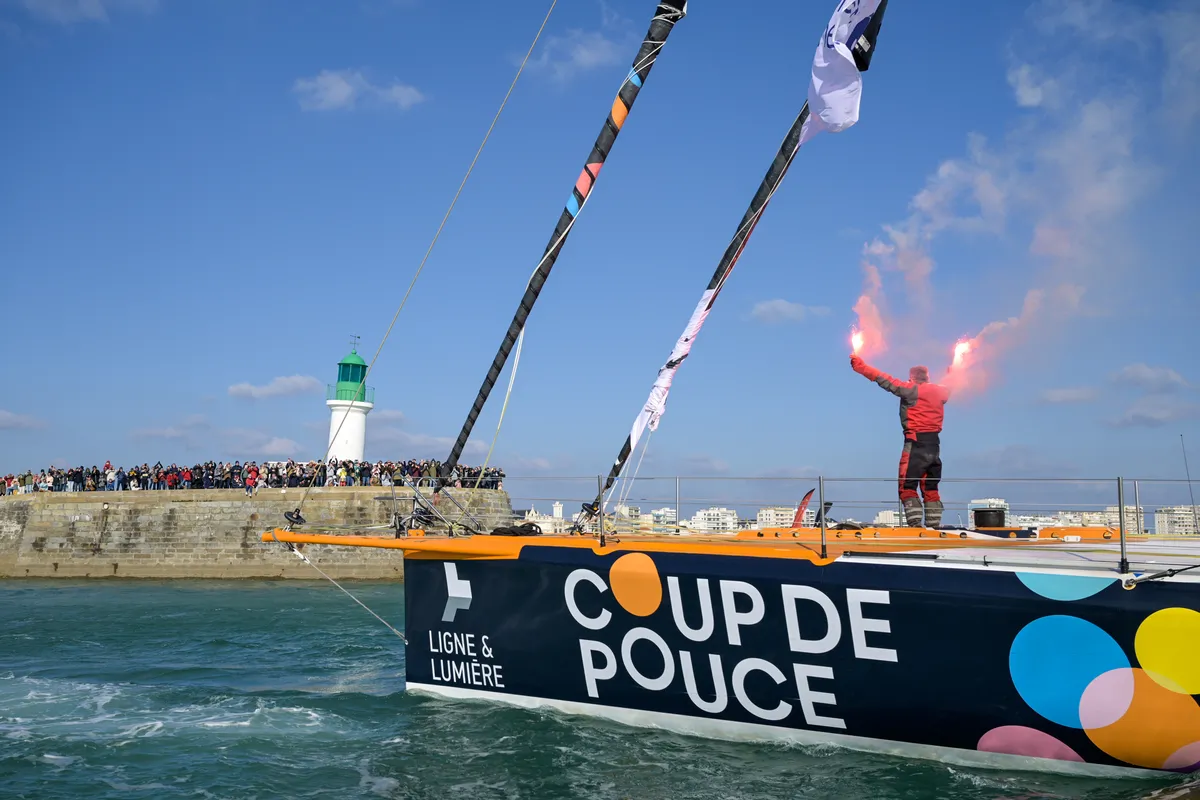 LES SABLES D’OLONNE, FRANCE - MARCH 01, 2025 : Coup de Pouce skipper Manuel Cousin (FRA) is celebrating with flares in the channel after taking 31st place in the Vendee Globe, on March 01, 2025 in Les Sables d'Olonne, France - (Photo by Olivier Blanchet / Alea)