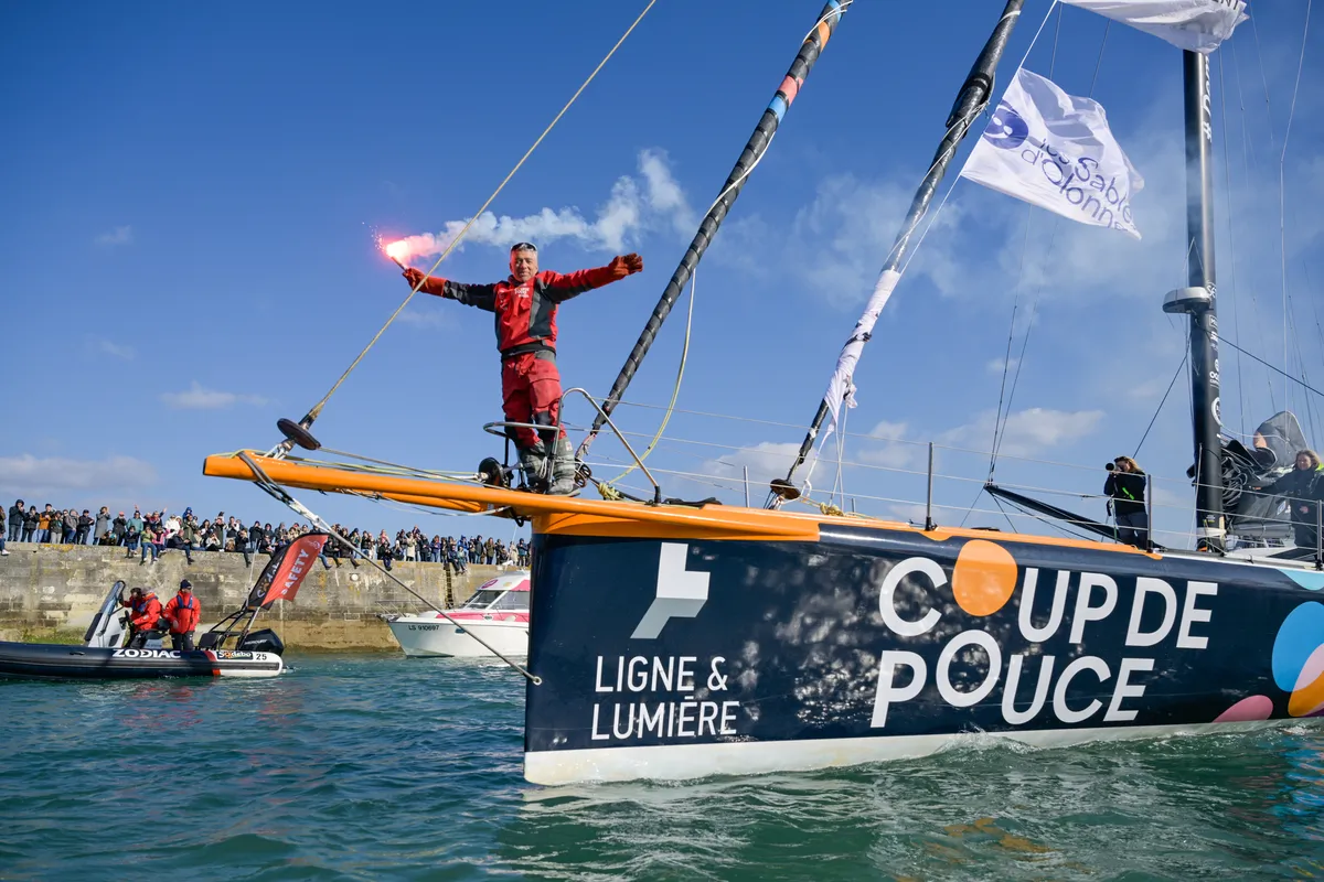 LES SABLES D’OLONNE, FRANCE - MARCH 01, 2025 : Coup de Pouce skipper Manuel Cousin (FRA) is celebrating with flares in the channel after taking 31st place in the Vendee Globe, on March 01, 2025 in Les Sables d'Olonne, France - (Photo by Olivier Blanchet / Alea)