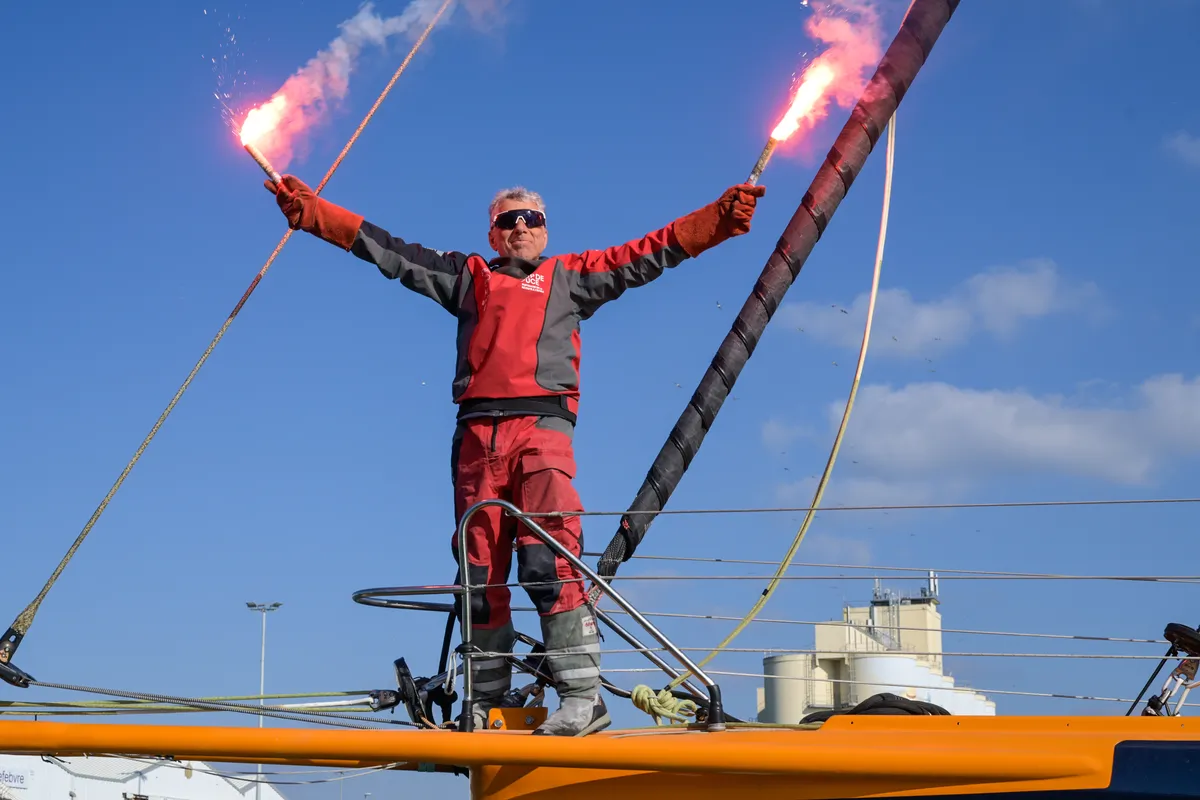 LES SABLES D’OLONNE, FRANCE - MARCH 01, 2025 : Coup de Pouce skipper Manuel Cousin (FRA) is celebrating with flares in the channel after taking 31st place in the Vendee Globe, on March 01, 2025 in Les Sables d'Olonne, France - (Photo by Olivier Blanchet / Alea)