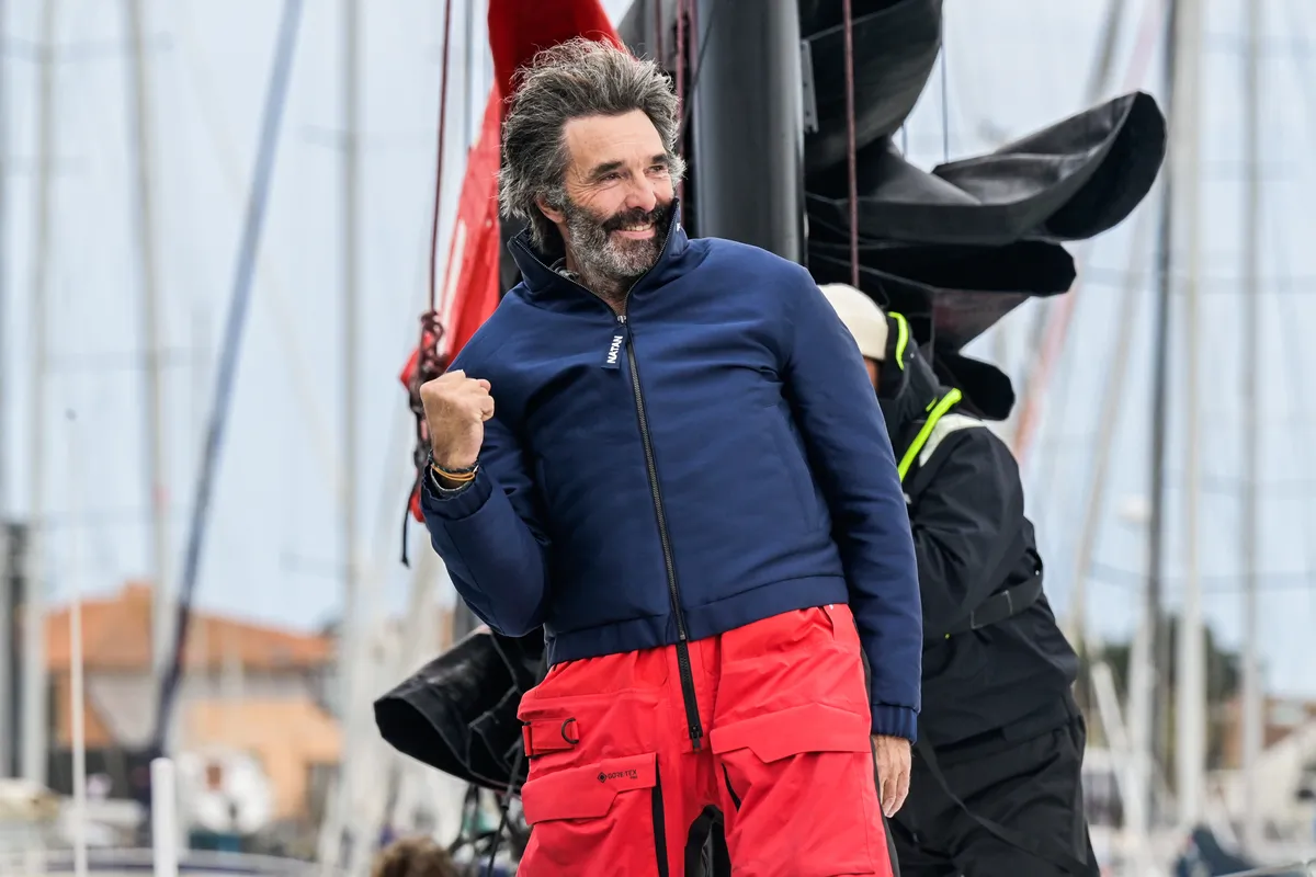 LES SABLES D’OLONNE, FRANCE - MARCH 08, 2025 : D’Ieteren Group skipper Denis Van Weynbergh (BEL) is photographed taking last place in the Vendee Globe, 1 day after the finish line had been closed sport-wise, hence not being classified, on March 08, 2025 in Les Sables d'Olonne, France - (Photo by Olivier Blanchet / Alea)