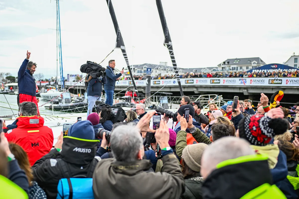 LES SABLES D’OLONNE, FRANCE - MARCH 08, 2025 : D’Ieteren Group skipper Denis Van Weynbergh (BEL) is photographed taking last place in the Vendee Globe, 1 day after the finish line had been closed sport-wise, hence not being classified, on March 08, 2025 in Les Sables d'Olonne, France - (Photo by Jean-Louis Carli / Alea)