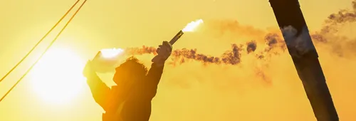 LES SABLES D'OLONNE, FRANCE - JANUARY 14, 2025 : MACIF Santé Prévoyance skipper Charlie Dalin (FRA) is photographed celebrating with flares after winning the Vendee Globe, on January 14, 2025 in Les Sables d'Olonne, France - (Photo by Jean-Louis Carli / Alea)