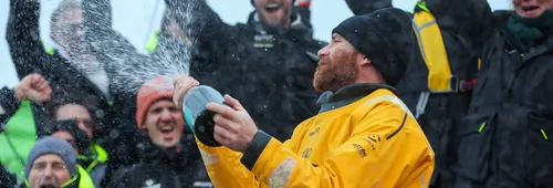 LES SABLES D'OLONNE, FRANCE - 31 JANVIER 2025 : GUYOT Environnement - Le skipper de Water Family Benjamin Dutreux (FRA) fête au champagne au ponton sa 10ème place dans le Vendée Globe, le 31 janvier 2025 aux Sables d'Olonne, France - (Photo by Lloyd Images / Alea)