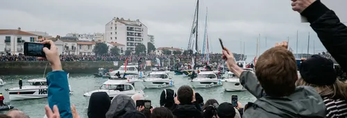 LES SABLES D’OLONNE, FRANCE - FEBRUARY 09, 2025 : Fans are cheering for DMG MORI Global One skipper Kojiro Shiraishi (JAP) and DeVenir skipper Violette Dorange (FRA) taking 24th and 25th place in the Vendee Globe, on February 09, 2025 in Les Sables d'Olonne, France - (Photo by Jean-Louis Carli / Alea)