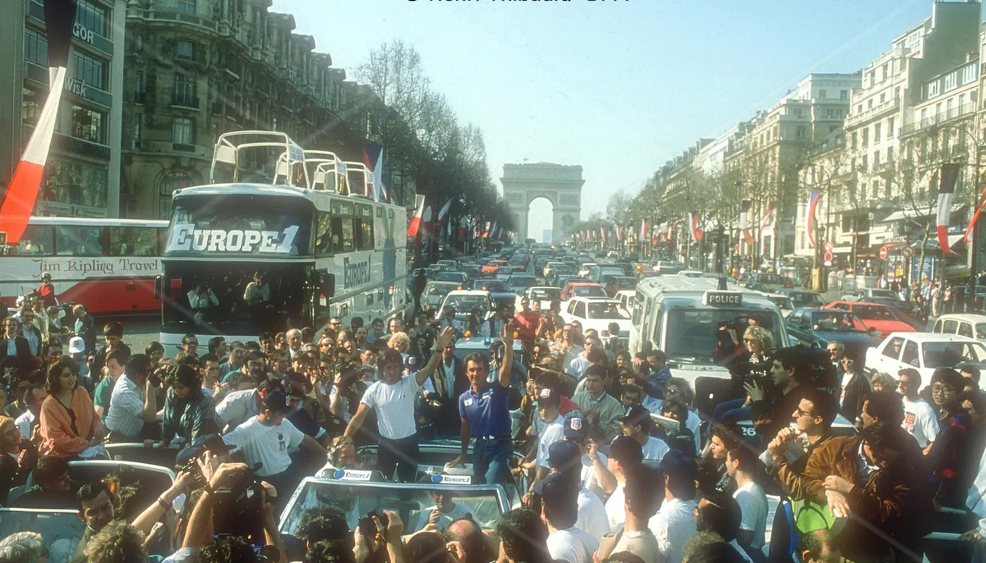 Titouan Lamazou and Loick Peyron going down the Champs Elysees after respectively finishing 1st and 2nd of the very first Vendee Globe 1989-1990, in Paris, France, on march 18, 1990 