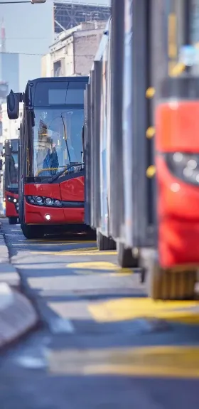 Three city buses parked one behind the other